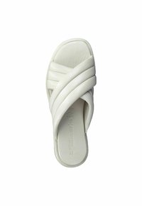 White slide sandal with padded crisscross straps and contoured footbed, designed for casual wear.