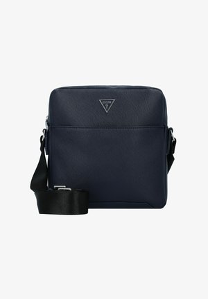 Marineblaue synthetische Umhängetasche mit strukturierter Oberfläche, verstellbarem Riemen und einem dreieckigen silbernen Logo auf der Vorderseite. Reißverschlussverschluss.