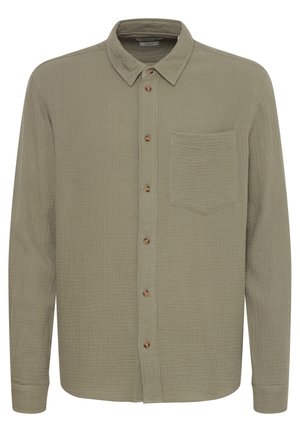 Long-sleeve, collared shirt in olive green, made of textured fabric. Features brown buttons and a single chest pocket.
