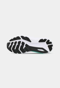 Shoe outsole features a textured black rubber pattern, with white midsole and a teal accent along the edge, designed for traction and stability.