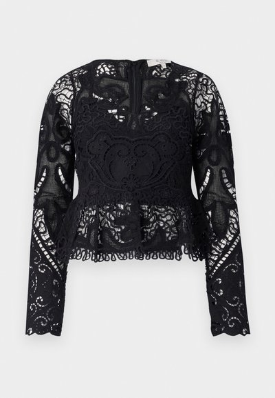 Čierny čipkovaný peplum top s dlhými rukávmi, zložitými kvetinovými vzormi a vlnitým lemom. Má okrúhly výstrih a uzáver na zips na zadnej strane.