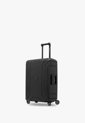 Maleta rígida negra con cuatro ruedas, asa retráctil y candado de combinación incorporado en el lateral, de la marca "REDOLZ."