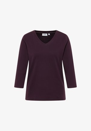 Top a manica lunga con scollo a V di color viola scuro. Realizzato in tessuto morbido con una vestibilità comoda. Nessun motivo visibile o dettagli in metallo.