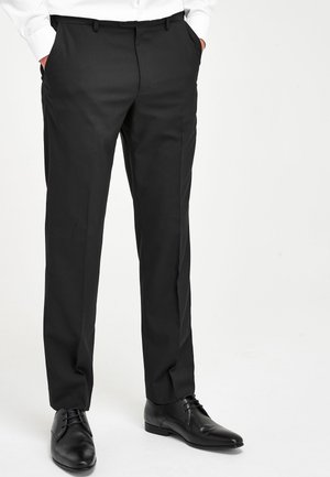 WITH MOTION FLEX WAISTBAND - Spodnie materiałowe - black