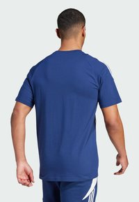 Navy blue short-sleeve t-shirt with a classic crew neck, featuring white accents along the sleeves and a smooth, lightweight fabric texture.