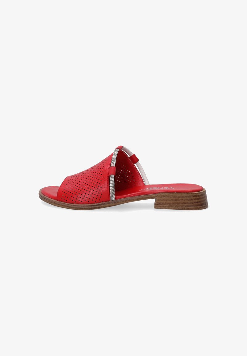 Red leather slide sandals with perforated design, metallic accents, open toe, and a low wooden heel.