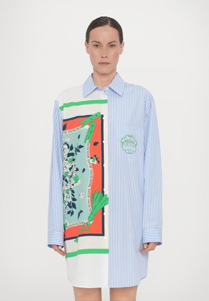 Shirt with a mix of blue and white stripes; large graphic print features floral and green accents; button-up design with collar and pocket.