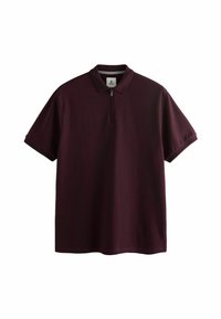 Polo en bordeaux en tissu texturé, avec un col zippé et des manches courtes. Design décontracté avec une coupe ample.