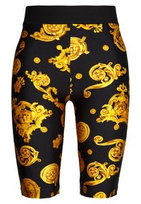 Black bike shorts with golden ornate patterns, featuring a fitted design and smooth texture; elastic waistband for comfort.