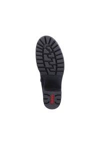 Black rubber shoe sole with a textured, patterned tread. Features a prominent red logo "Rieker" near the heel. Dual arch support grooves visible.