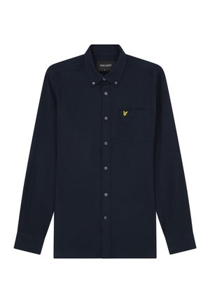 Camisa de manga larga azul marino, hecha de algodón, con cuello abotonado, que cuenta con un bolsillo en el pecho y un logo de águila bordado en amarillo.