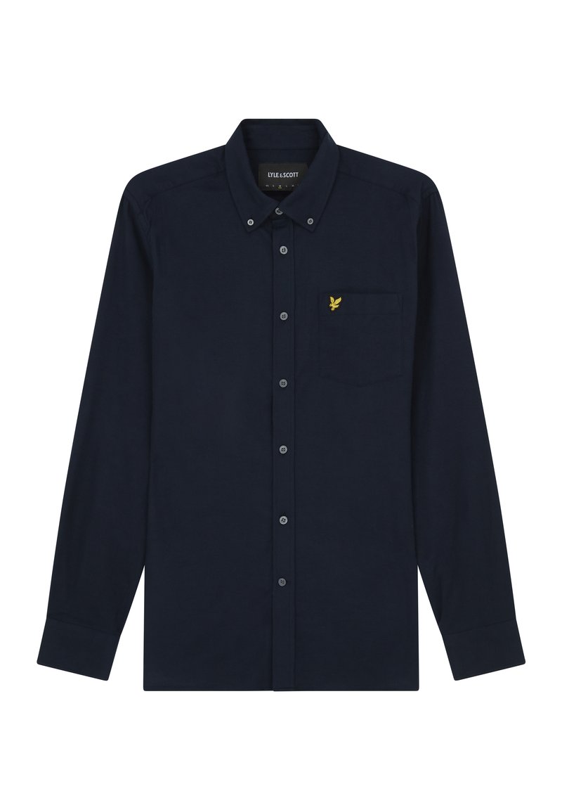 Camisa de manga larga azul marino, hecha de algodón, con cuello abotonado, que cuenta con un bolsillo en el pecho y un logo de águila bordado en amarillo.