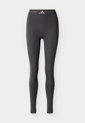 Black full-length athletic leggings with a pink-accented waistband featuring a logo centered on the front.