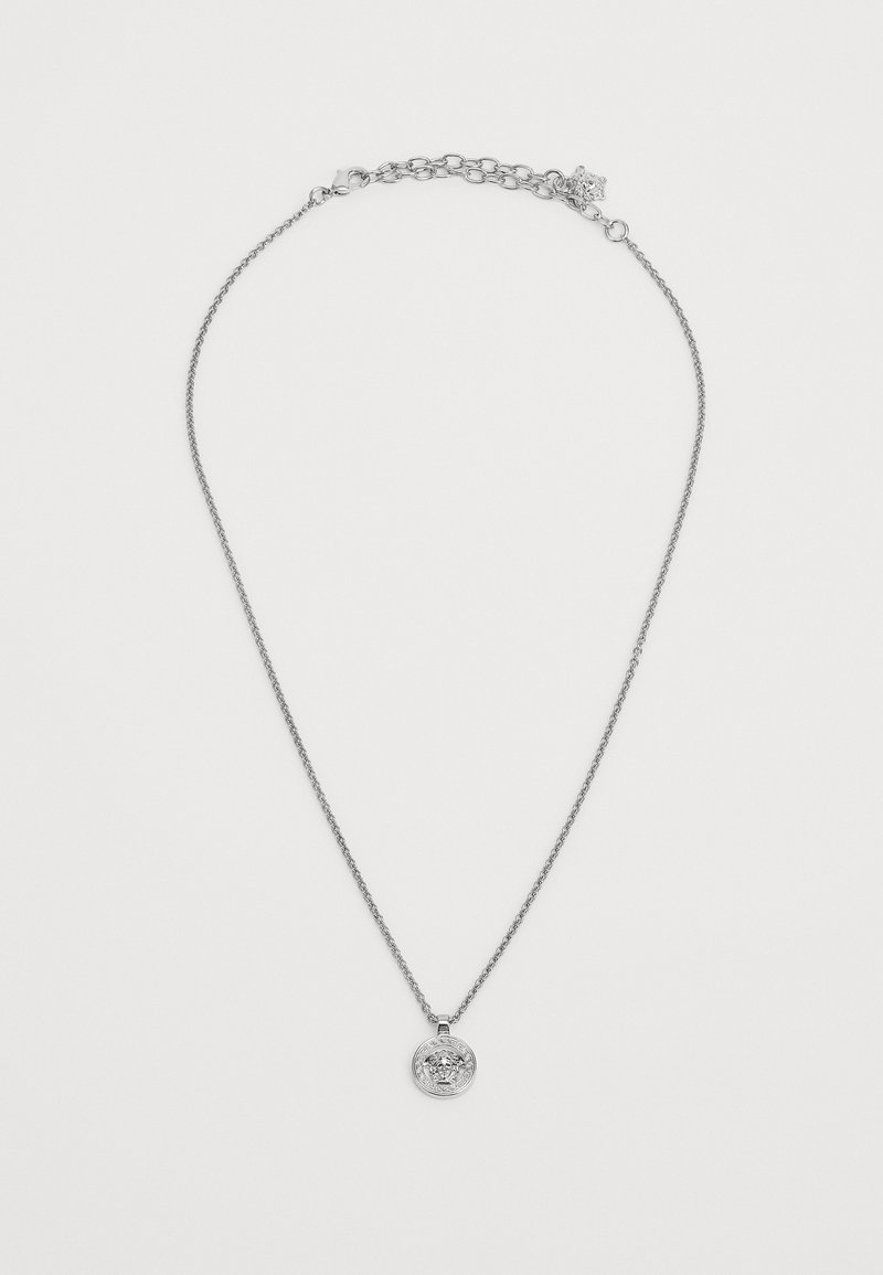 Hõbedane kaelakee, millel on õhuke kett ja ringikujuline ripats, millel on keeruline disain. Kett sisaldab väikest kohandamisplekk.