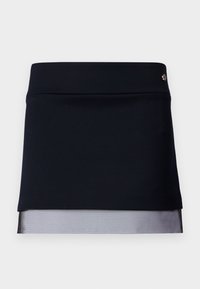 Zwarte rok met een goed passende tailleband en een doorschijnende mesh onderrand. De stof is soepel met een gestructureerd ontwerp, met een kleine metalen accent.