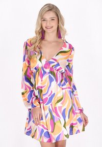 Färggark A-linje klänning med djup V-ringning, långa puffärmar, tillverkad av lättviktsmaterial med abstrakta virvlar i rosa, lila, orange och grönt.