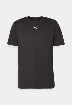 Camiseta de manga corta negra hecha de tela suave, con un logo de Puma blanco centrado en el pecho, cuello redondo y ajuste estándar.