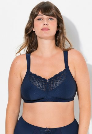 Donkerblauwe bh met kant afwerking en gevlekte textuur, voorzien van verstelbare bandjes en een klein decoratief knoopje in het midden.