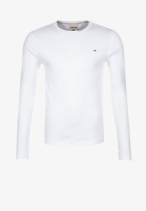 T-shirt bianco a maniche lunghe, colletto girocollo, in cotone. Piccolo logo ricamato sul lato sinistro del petto in rosso e blu. Texture morbida.