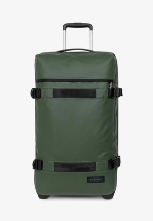Valise à roulettes verte verticale avec poignée télescopique, sangles de compression noires et logo Eastpak dans le coin inférieur avant.