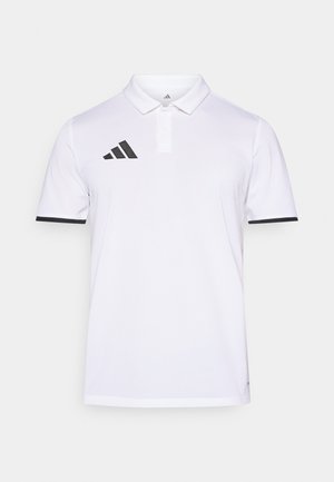 White polo shirt made of light fabric, featuring a three-button placket, black accents at sleeves, and a black Adidas logo on the chest.