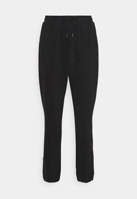 Black sweatpants made of soft fabric feature an elastic waistband with a drawstring, elastic cuffs, and a relaxed fit design.