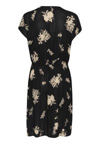 Zwarte crêpe jurk met kapmouwen en een elastische taille, voorzien van een bloemenpatroon in crème. Kniehoog met een ontspannen pasvorm.