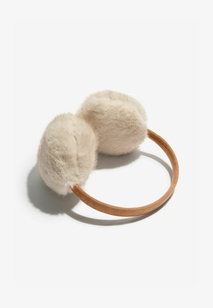 Dirbtinių kailių ausinės šviesiai beigėje spalvoje su švelnia tekstūra, derinamos su rudos zomšinės galvos juosta. Suapvalinta forma su dviem puriais ausų dangteliais.