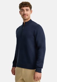 Navy Pullover-Sweatshirt mit hohem Kragen und Reißverschluss, aus glattem Material gefertigt. Verfügt über gerippte Bündchen und Saum, Slim-Fit-Design.