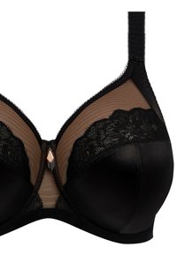Soutien-gorge noir avec une coupe satinée lisse ornée de détails en dentelle, des panneaux en tulle transparent et des bretelles réglables. Détail matériel délicat au centre.