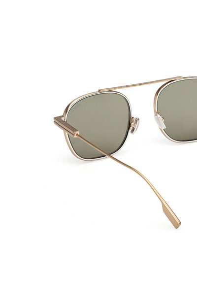 Metal sunglasses with an angular frame, gold-tone finish, and green lenses. Features include a double bridge and transparent nose pads.