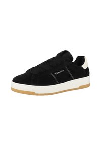 Sneaker in suede nero con suola in gomma bianca e suola esterna in gomma, caratterizzata da lacci spessi e dettagli cuciti. Logo del marchio sul lato esterno.