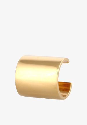 Bracelet en métal doré avec une surface lisse et brillante, des bords arrondis, une forme tubulaire et un design ouvert. Convient à diverses tailles de poignet.