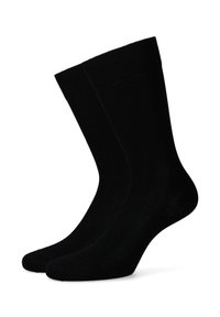 Czarne skarpetki bawełniane o gładkiej fakturze, prążkowanym mankiecie i klasycznej długości crew, zaprojektowane z myślą o komforcie i trwałości.