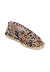 Chaussure slip-on en toile présentant un motif abstrait coloré avec des formes noires, rouges, bleues et jaunes ; semelle en jute avec des accents cousus.