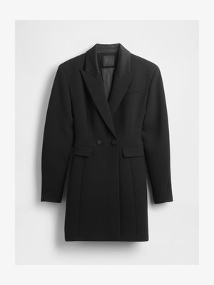 Fekete, testhezálló blézer strukturált anyagból. Bélyegzett gallérral, kétsoros gombokkal és két első zsebbel rendelkezik.