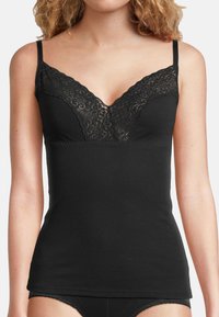 Zwarte top met verstelbare spaghettibandjes, met een kanten overlay bij de halslijn, aansluitende pasvorm en zachte, rekbare stof.
