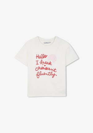 T-shirt enfant blanc à manches courtes avec texte rouge "Hello I speak croissant fluently" et un petit graphique de croissant rose.