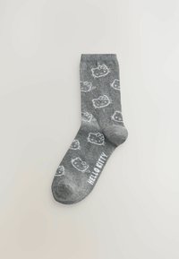 Grijze katoenen sok met een herhaald wit Hello Kitty-patroon en de tekst "HELLO KITTY" aan de zijkant, met een geribde rand en een gladde textuur.