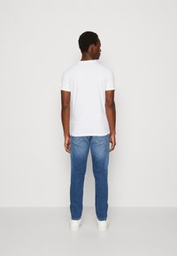 Calvin Klein Jeans DISRUPTED MONOLOGO  - Camiseta estampada - bright white
