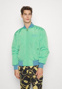 Versace Jeans Couture PRINTED GARLAND - Blusão aviador - blue/gold