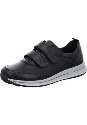 Black leather athletic shoe featuring two adjustable Velcro straps, a cushioned sole, and a subtle white accent on the midsole.