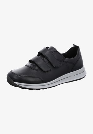 Black leather athletic shoe featuring two adjustable Velcro straps, a cushioned sole, and a subtle white accent on the midsole.