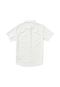 Chemise blanche à manches courtes avec un motif subtil de petits diamants beiges. Elle présente un col classique et un ourlet arrondi.