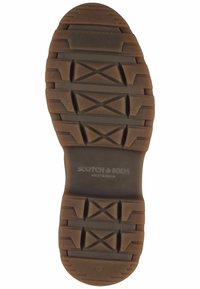 Braune Gummisohle mit tiefem Profil und Kreuzmustern. Mit der Markenkennzeichnung "SCOTCH & SODA" und der Größenmarkierung "41" in der Nähe der Ferse.