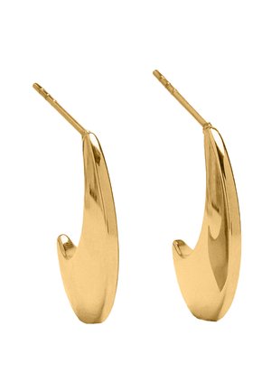 Kolczyki z metalowym, złotym wykończeniem o płynnym, zakrzywionym kształcie. Gładka powierzchnia z polerowanym wykończeniem. Wyposażone w zawiasowe zapięcie zapewniające pewne noszenie.