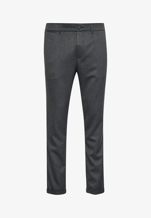 Tamsiai pilkos pritaikytos kelnės, pagamintos iš audinio, pasižyminčio audiniu, su plokščiu priekiu, užtrauktuku ir sukytomis rankovėmis. Lygus paviršius su subtiliomis raštų detalėmis.