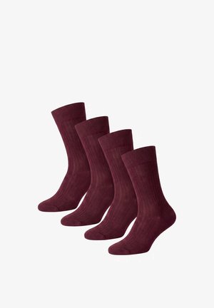 Quattro paia di calzini corti a costine di colore rosso scuro disposti uno accanto all'altro su uno sfondo bianco.