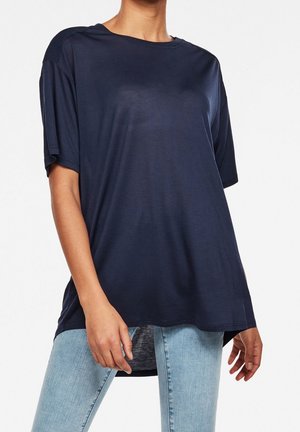 Navy blue short-sleeve t-shirt made of a smooth, lightweight fabric, featuring a round neckline and relaxed fit with side slits.