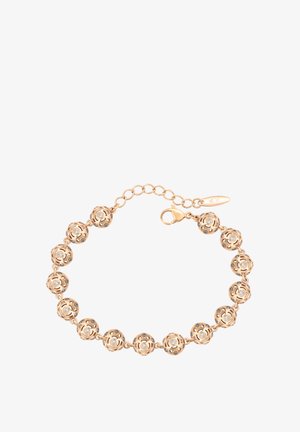 Brățară cu tonuri de aur, prezentând mărgăritare rotunde din filigram cu decupaje complexe și cristale mici încorporate. Închidere reglabilă cu lanț de extensie.